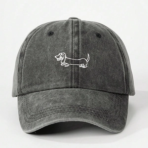 Detail of embroidered dachshund outline on charcoal washed denim baseball cap