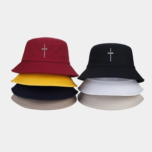 Multiple colors of vintage style cotton fisherman hats with peace embroidery on front