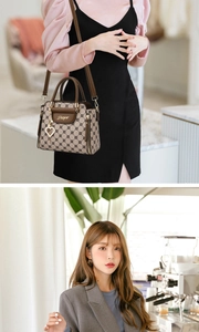 Close-up of brown monogram tote bag with heart tassel and detachable shoulder strap