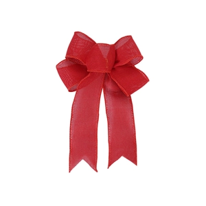 Close-up of red burlap decorative bow with woven texture for Christmas tree decoration
