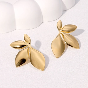 Elegant gold leaf-shaped stainless steel stud earrings for women with a polished finish