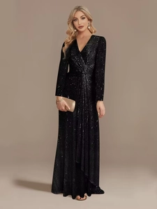 Close-up of black sequin evening gown featuring a deep V-neck and twisted waist detail