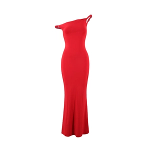 Detail of elegant red bodycon dress with asymmetric shoulder cut and slim fit silhouette