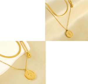 Detail of gold double-layered necklace featuring a hexagram star pendant and snake chain