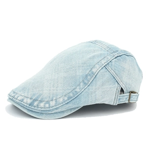 Macro detail of washed blue denim flat cap showing metal buckle and fabric texture