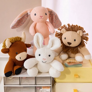 Handmade crochet stuffed animals set featuring rabbit, cow, and lion dolls for kids