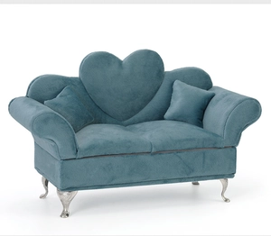 Blue velvet sofa jewelry box with heart-shaped backrest and silver metal legs detail