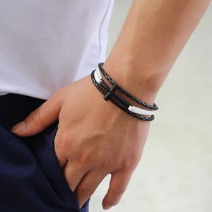 Multilayer braided leather bracelet with black cross element for casual fashion styling