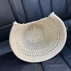 Beige hollow-out knit bucket hat with breathable crochet pattern for sun protection