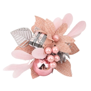 Exquisite pink Christmas floral decoration with pine cones and berries on white background