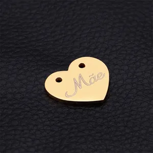 Golden heart-shaped stainless steel pendant with 'Mãe' engraving for jewelry making