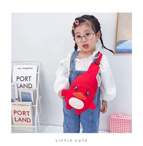 Detail shot of a red cartoon duck chest bag for kids with adjustable shoulder strap