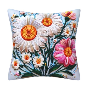 Detail shot of 3D floral embroidery cushion cover with daisy pattern on square pillow