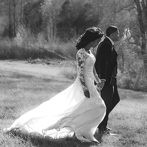Elegant long sleeve lace applique chiffon bridal gown with long train in outdoor setting
