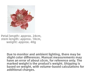 Detailed view of red velvet artificial Christmas flower with gold sequins and petals