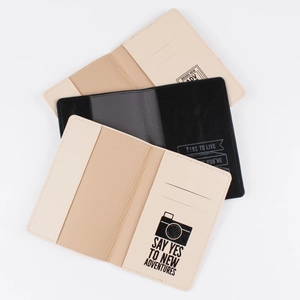 Detail view of printed PU leather passport covers with card slots and inner adventure quotes