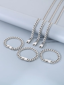 Detail of silver Cuban chain set with secure square press buckle on a blue background