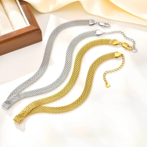 Detail of 18K gold and silver mesh chains with lobster clasp and extension chain