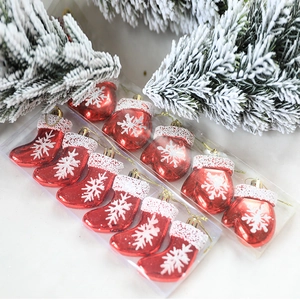 Set of 10 red Christmas ornaments with white snowflake patterns and gold hanging cords