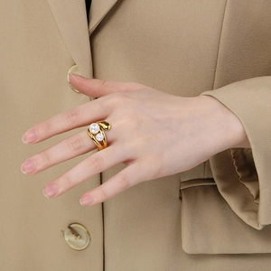 French minimalist irregular double-layer ring with pearls in a golden finish