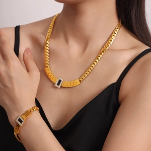 Gold-plated titanium steel necklace and bracelet set with black rectangular inlay and zircons