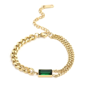 Gold titanium bracelet with emerald green rectangular gemstone and unique dual-chain design