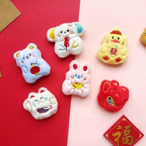 Plush Chinese New Year brooches featuring Fortune Cat, rabbit and duck characters