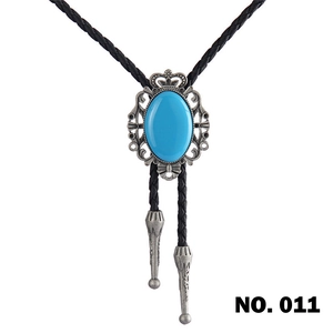Detail of western bolo tie with blue oval turquoise stone and vintage silver alloy carving