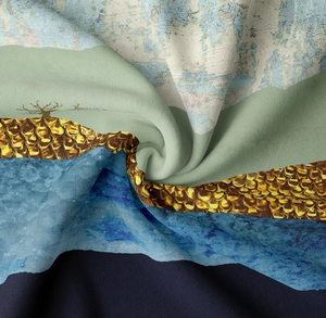 Detailed close-up showing abstract mountain print fabric with golden scale textures