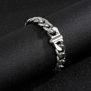 Close-up of classic 13mm silver stainless steel Cuban link chain with detailed buckle