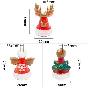 Three assorted Christmas ceramic beads showing moose, angel and gift shapes with sizes