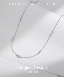 Detail of silver S925 choker with five sparkling round-cut cubic zirconia stones