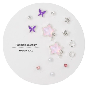 Titanium steel stud earrings set with pink rhinestones and pearls on display card