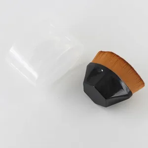 Flat lay of a professional 55 foundation brush with dense bristles and a storage case