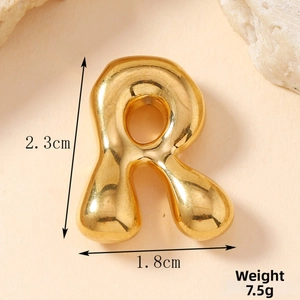 Detail showing gold bubble letter R pendant with dimensions 2.3cm by 1.8cm and 7.5g weight