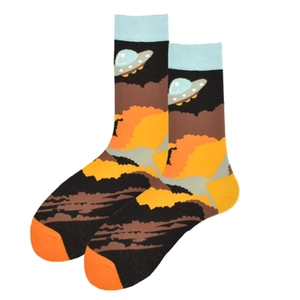 Detail of crew socks featuring a UFO sci-fi graphic with orange sunset clouds pattern