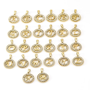 Detailed view of 26 gold 18K stainless steel alphabet pendants with sparkling zircon stones