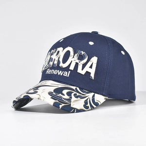 Close-up of 3D white Aurora embroidery on a navy baseball cap with patterned visor
