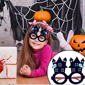 Close-up of Halloween felt eyeglass frame with castle and ghost party decorations
