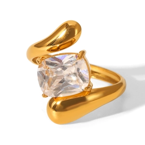 Macro detail of gold-plated ring featuring a large square-cut sparkling zircon setting