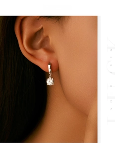 Detail view of 6.5mm 1.0ct moissanite earring in s925 silver on model's ear