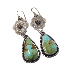 Bohemian vintage flower earrings with blue turquoise teardrop pendants on white background