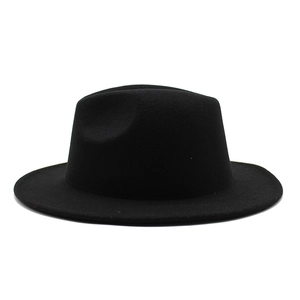 Detail of classic black fedora hat showing thick wool felt texture and structured crown
