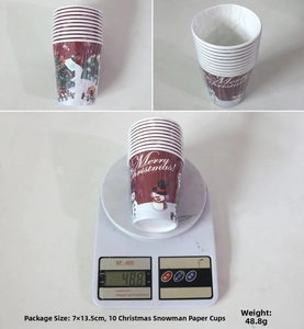 Close-up of festive Merry Christmas paper cups featuring snowmen and reindeer illustrations