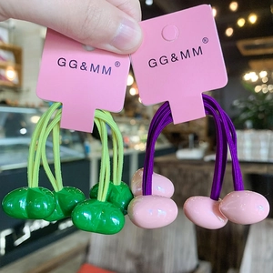 Colorful elastic hair ties with cherry resin charms in green, yellow and pink shades