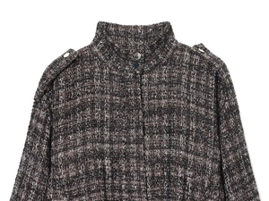 Detail of tweed bomber jacket with silver metallic buttons and epaulet shoulder design