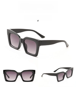 Detail view of model 95157 oversized square sunglasses in bright black with grey lenses