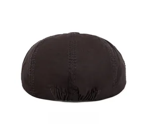 Detail of cotton newsboy cap back showing elastic band and vertical stitching lines