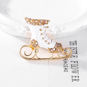 Christmas ice skate brooch with white enamel and colorful rhinestones on gold alloy