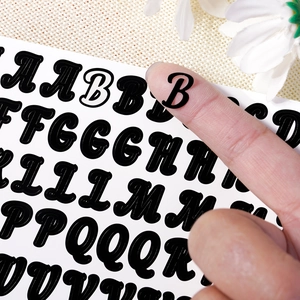 Black glossy alphabet stickers with white border for DIY crafts and nail art decoration